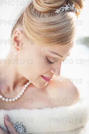 Hispanic bride looking down