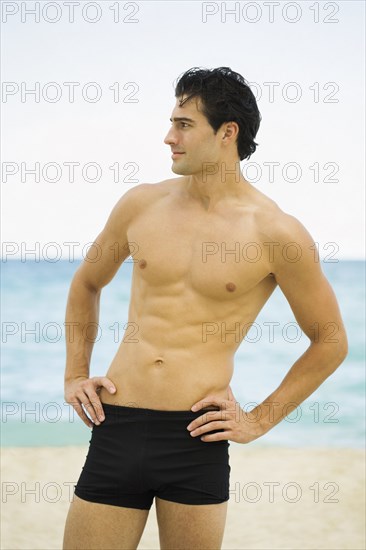 Caucasian man standing on beach