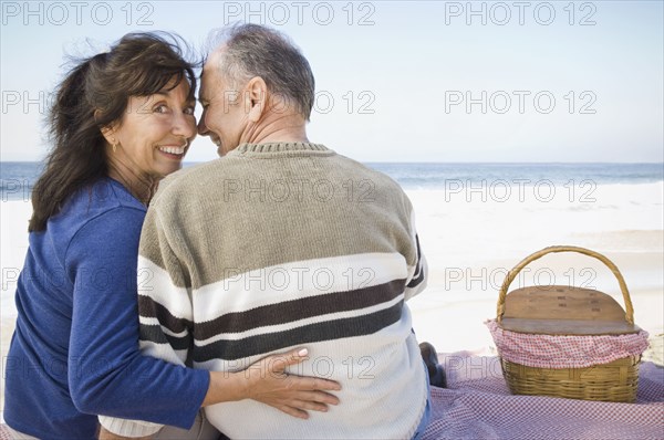 Couple having picnic on beach