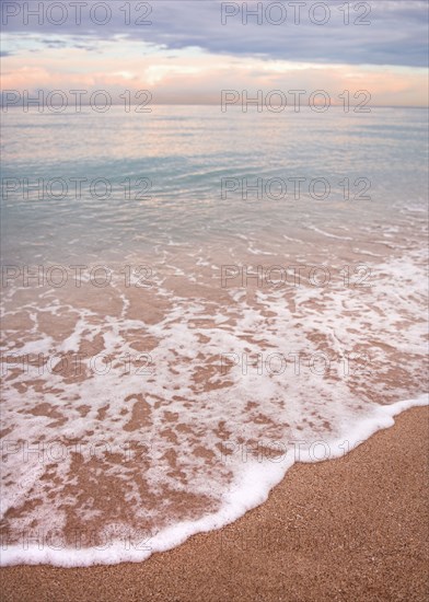 Waves washing up on tropical beach