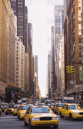 Taxis driving on city street