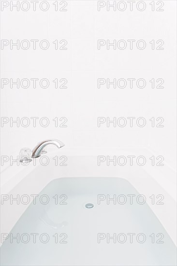 Faucet over full bathtub