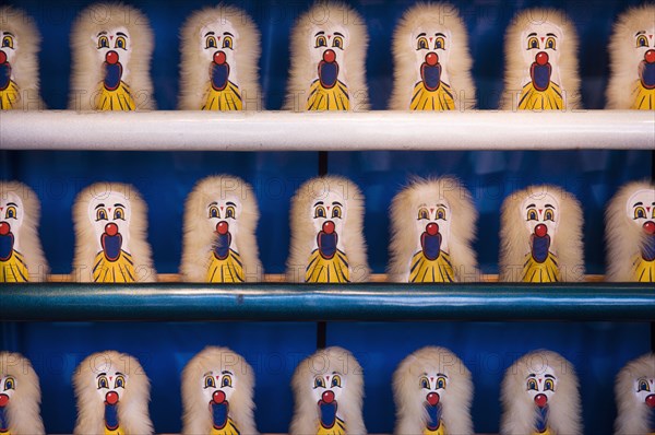 Amusement park shooting game targets on shelves