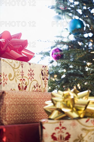 Close up of wrapped gifts under Christmas tree