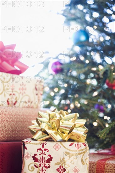 Close up of wrapped gifts under Christmas tree