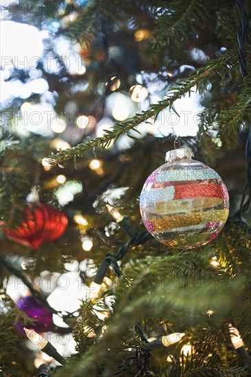 Close up of ornaments hanging on Christmas tree