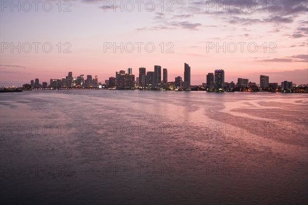 Miami city skyline and harbor at sunset