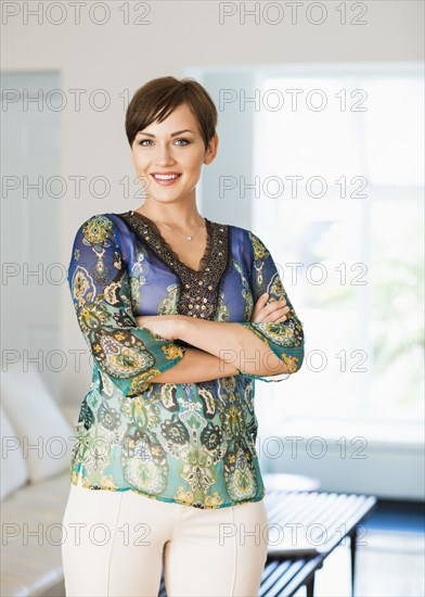 Caucasian woman standing in living room