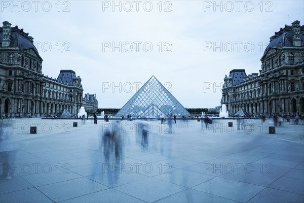 Blurred view of people outside Louvre museum
