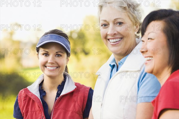 Women smiling on golf course