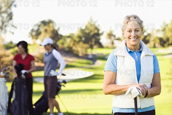 Woman playing golf on golf course