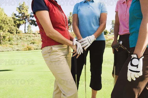 Women standing on golf course