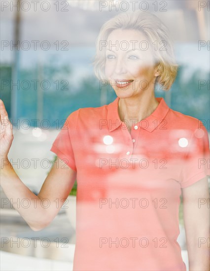 Caucasian woman looking out window