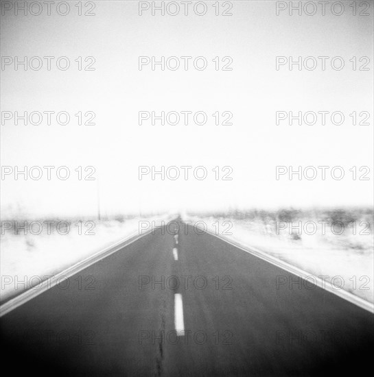 Defocused view of empty road