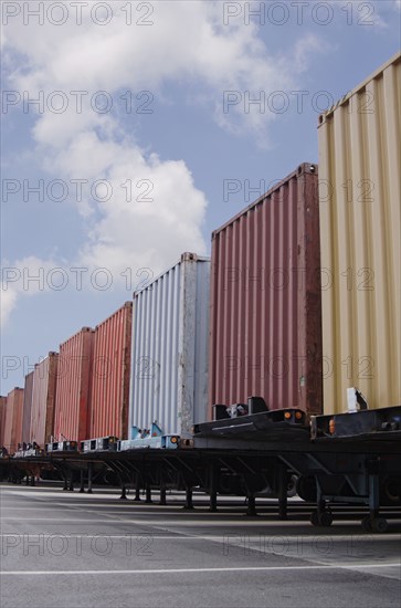 Cargo containers in parking lot