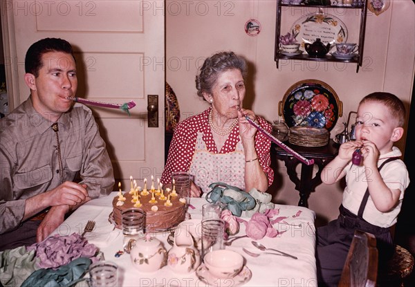 Multi-generation family celebrating birthday