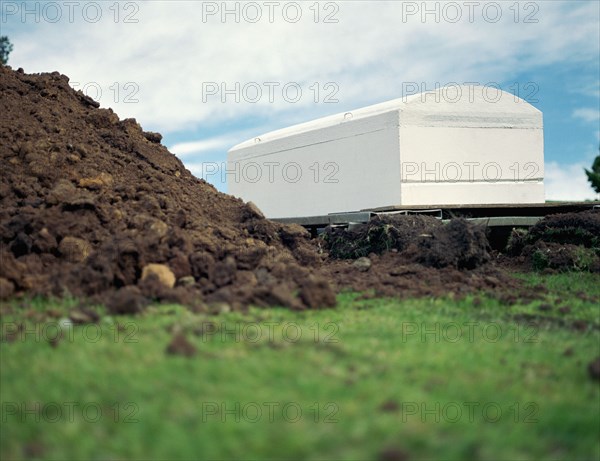 Coffin waiting near grave