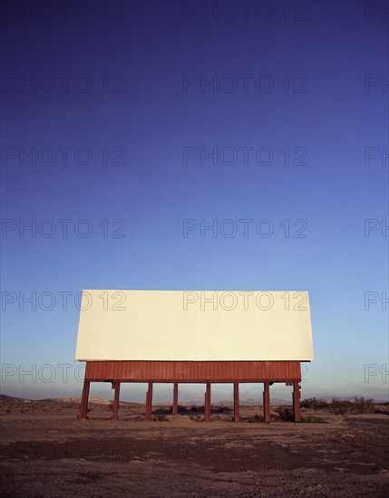 Blank billboard in remote landscape