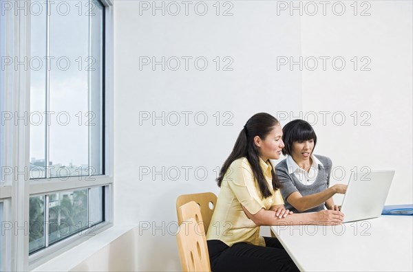 Businesswomen using laptop