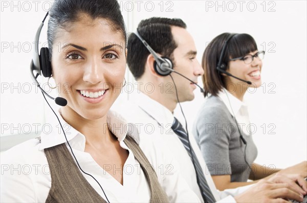 Customer service representatives wearing headsets