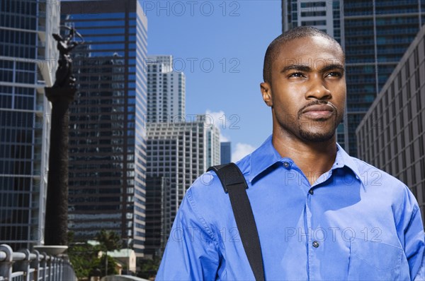 Serious African American businessman in city