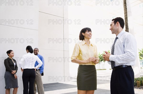 Business people talking outdoors