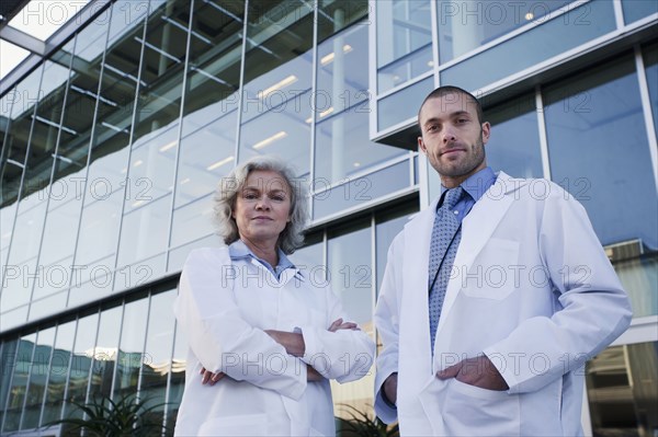 Serious doctors standing outdoors