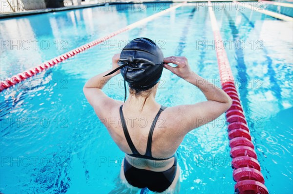 Competitive swimmer in swimming pool