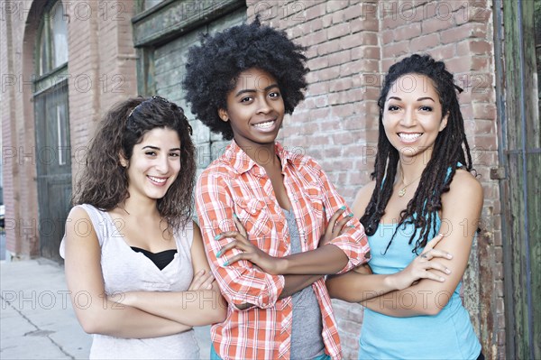 Smiling women standing together