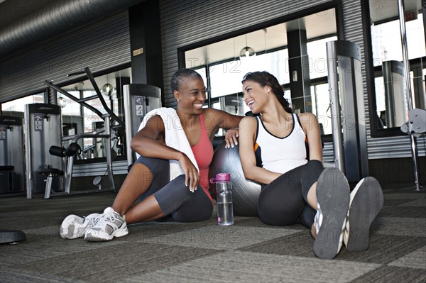 Women sitting together and talking in health club