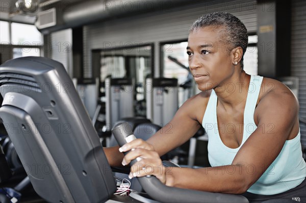 African American woman exercising in health club