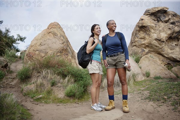 Mother and daughter hiking together