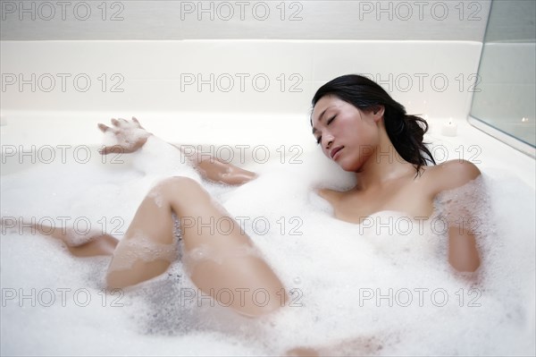 Woman enjoying bubble bath