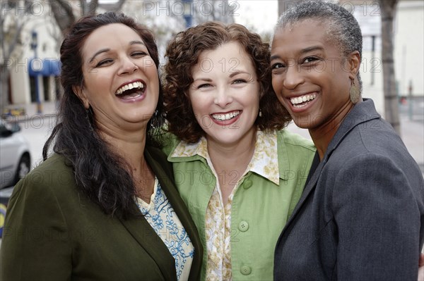 Smiling friends standing together