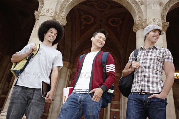 Students standing outdoors together on campus