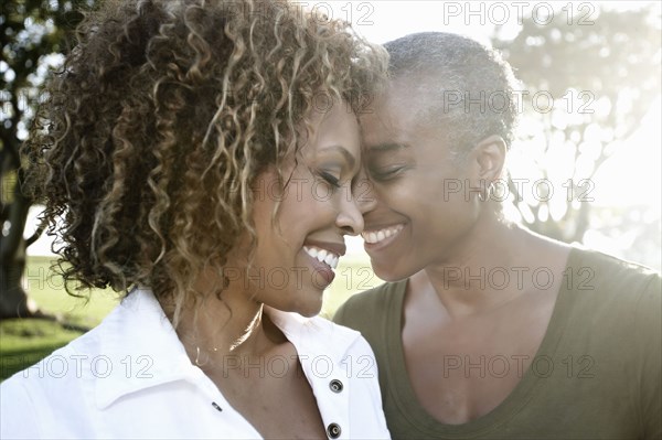 Smiling African American mother and daughter