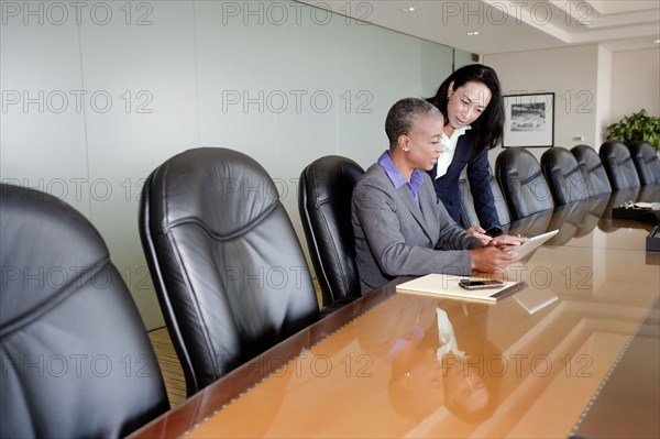 Businesswomen working together in conference room