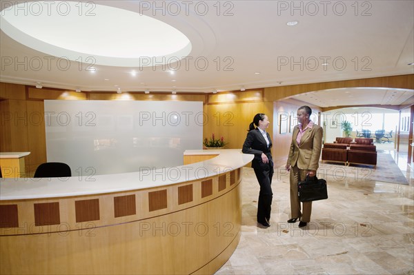 Businesswomen talking in office