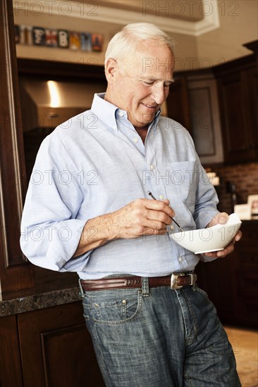 Caucasian man holding bowl