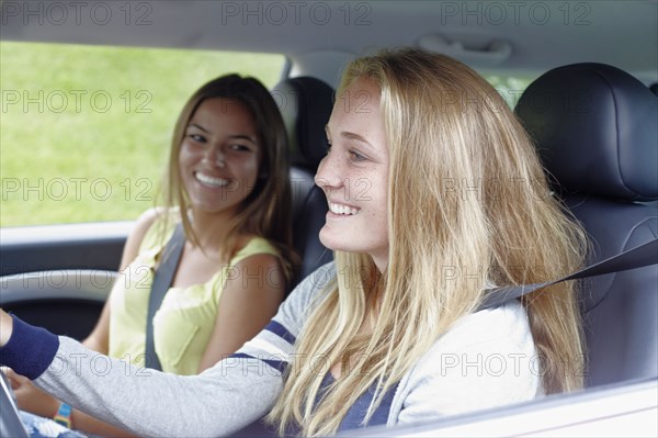 Caucasian teenagers in car