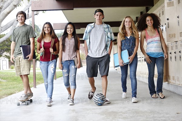 School friends walking in portico