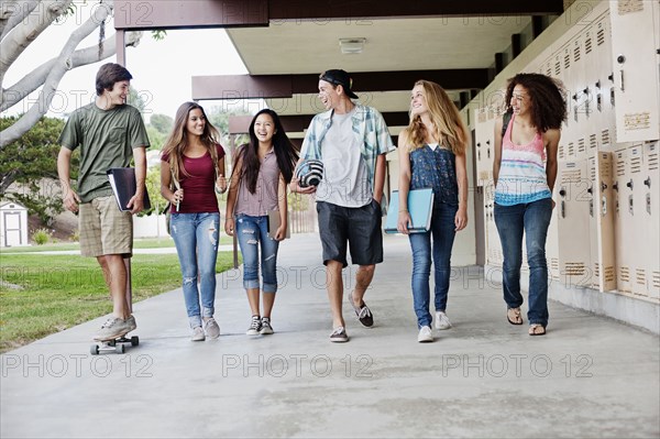 School friends walking in portico