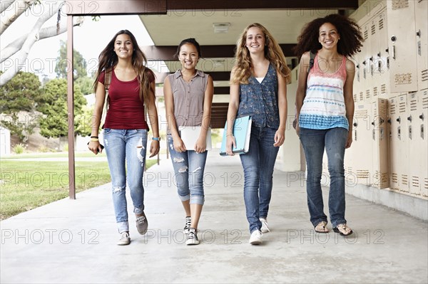 School friends walking in portico