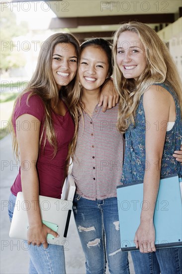 School friends standing in portico