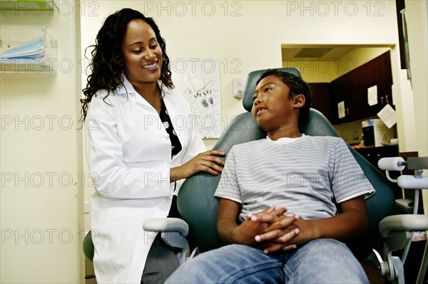 Dentist and patient in dental office