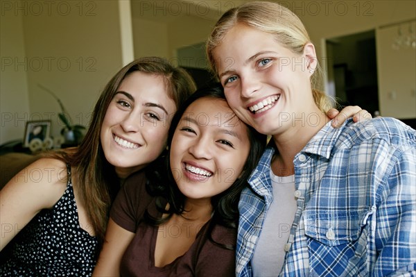 Smiling girls sitting together