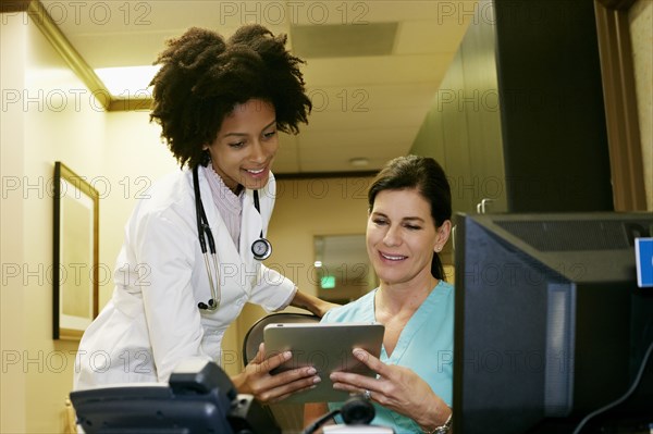 Doctor and nurse using digital tablet