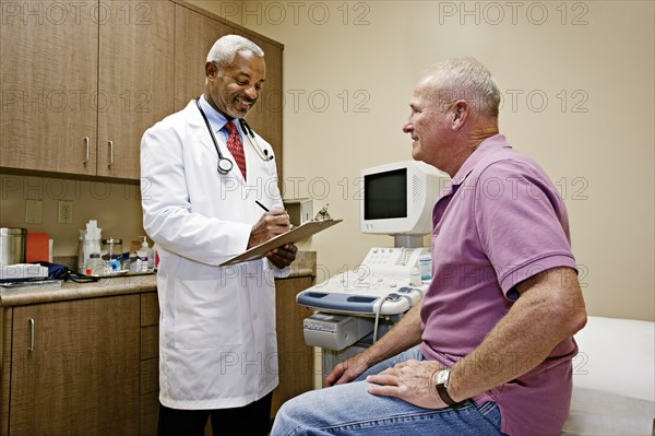 Doctor talking to patient in office