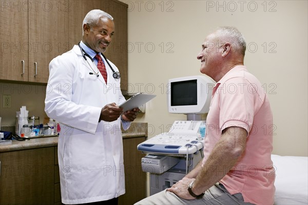 Doctor talking to patient in office