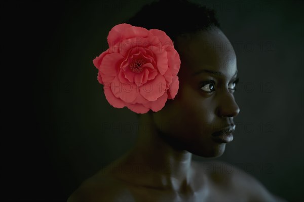 African American woman wearing flower in hair